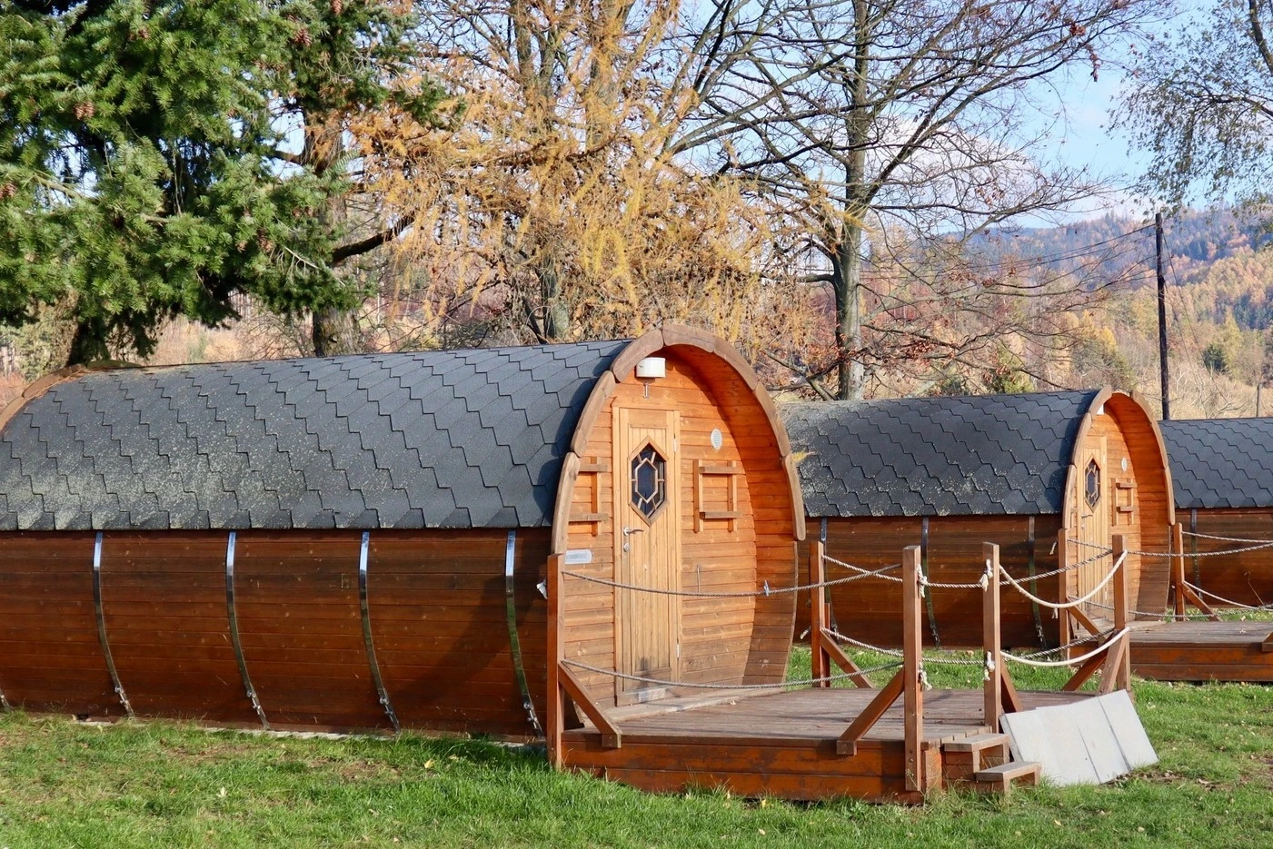 Illustrative glamping pod in a grassy rural setting